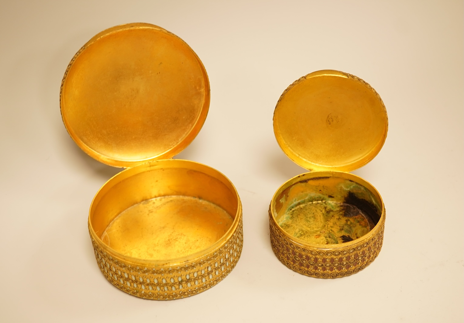 Two Limoges enamel mounted gilt filigree work circular boxes, largest 8cm diameter